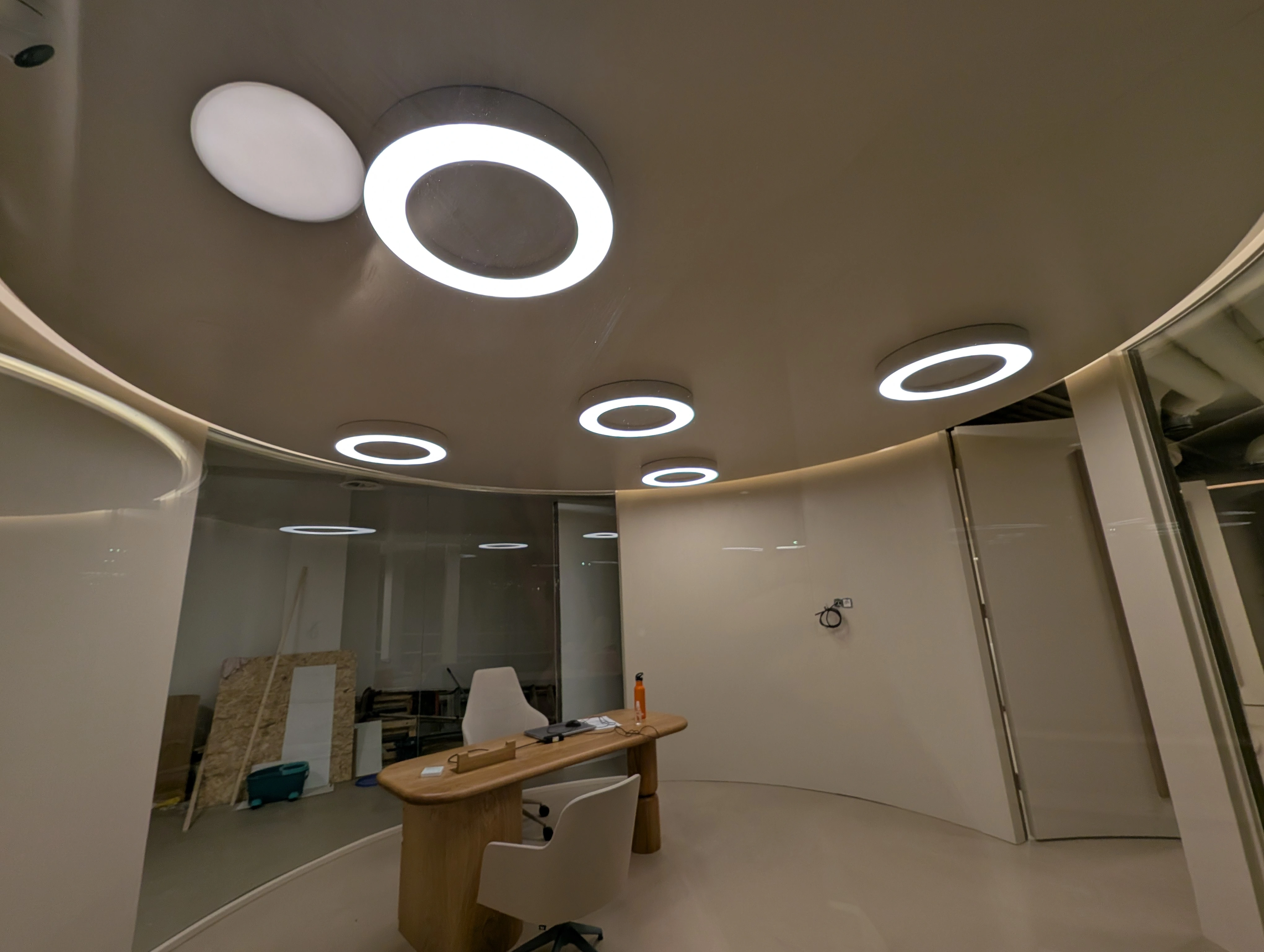 Modern open-plan office with acoustic ceiling panels